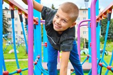 boy-playground-cheerful-child-playing-yard-happy-summer-vacations-159582900.jpg