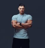 portrait-muscular-handsome-bodybuilder-sportswear-standing-with-crossed-arms-studio-isolated-g...jpg