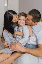 happy-young-family-parents-and-little-son-portraits-of-mom-dad-and-little-son-in-their-arms_12...jpg